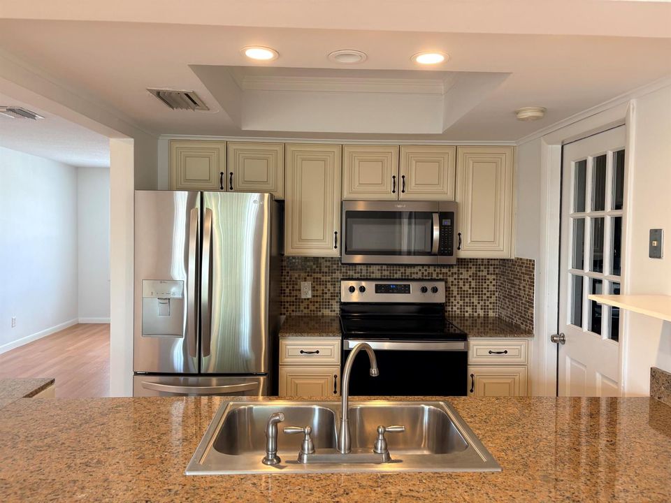 KITCHEN, DINING AND LIVING ROOM