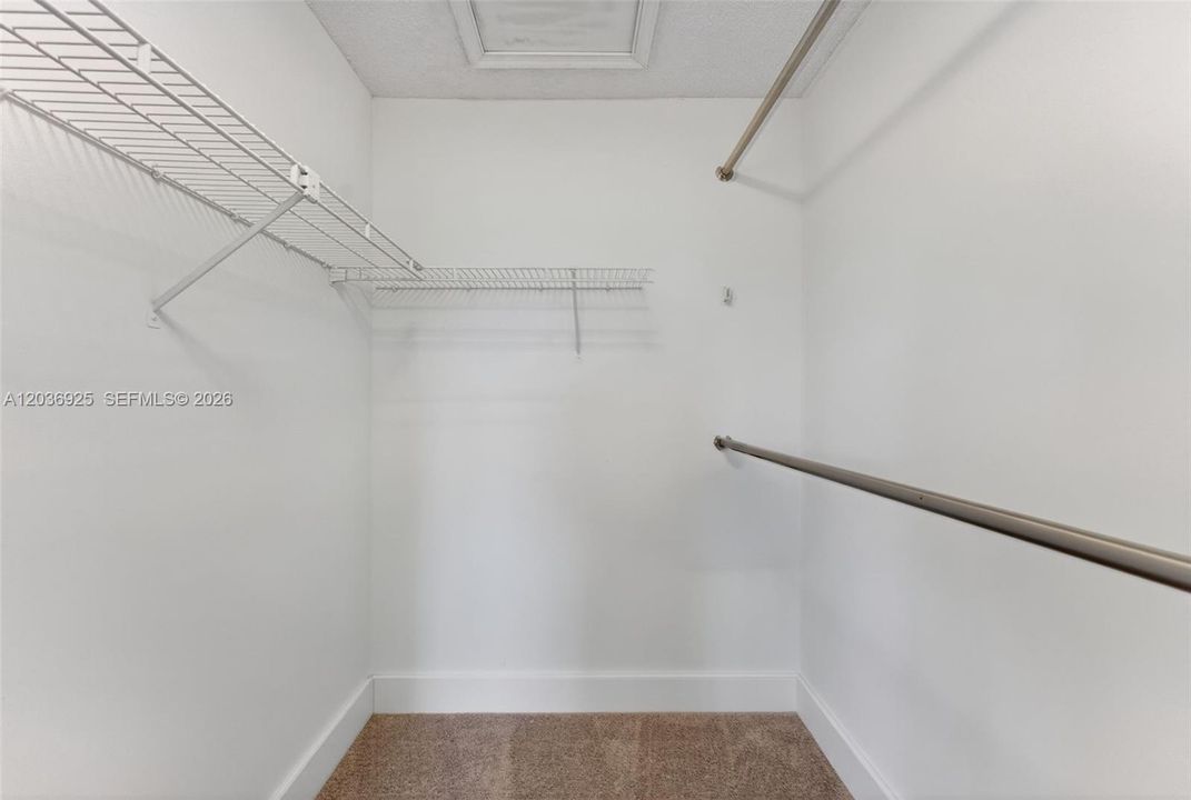 Closet in primary bedroom.