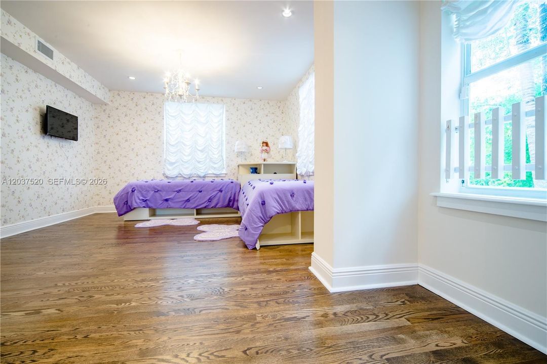 Spacious 3rd bedroom upstairs with private bathroom and walk-in closet. Faces east (front yard).