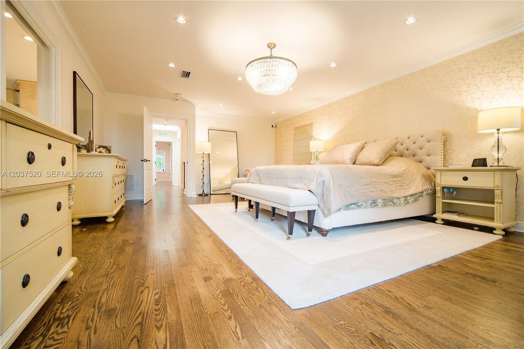 Spacious Primary Suite overlooking back yard and pool area.