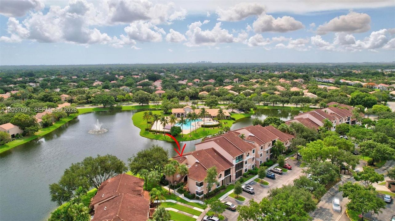 Exceptional lakefront location and a front-row view of the community pool and spa/hot tub in sought-after Fountain Springs