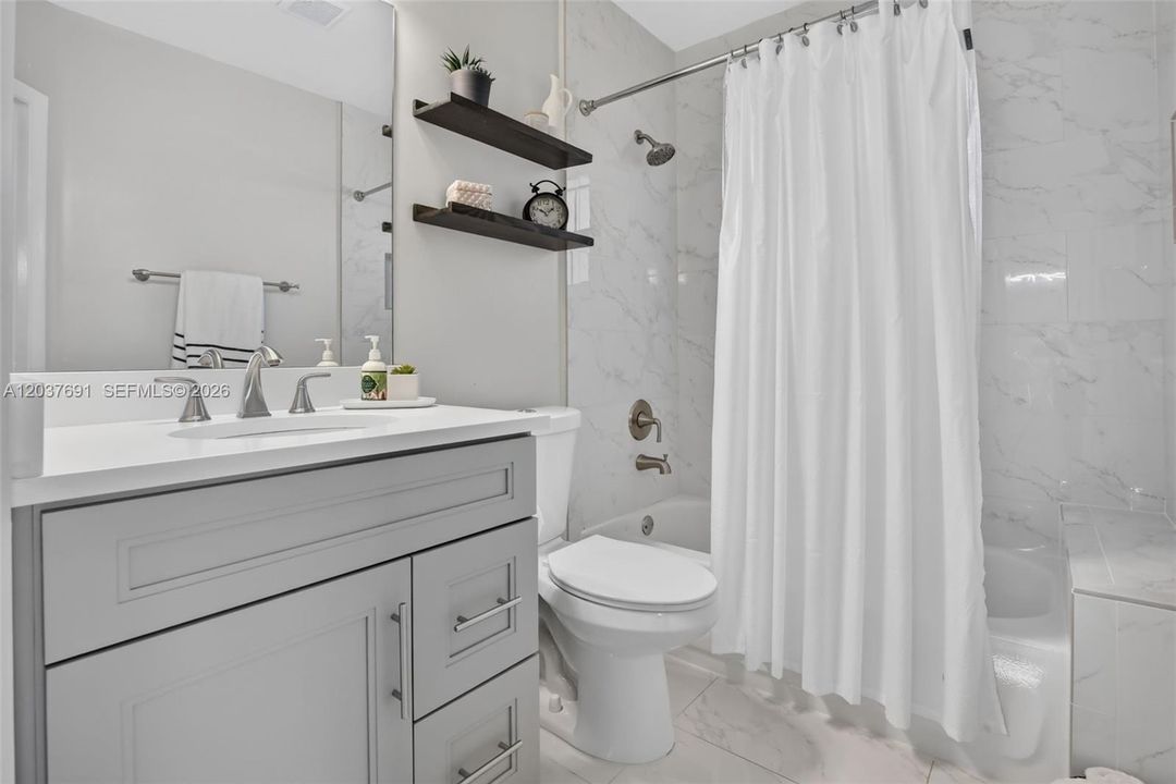 Tastefully updated guest bath reflects the quality and craftsmanship found throughout the home
