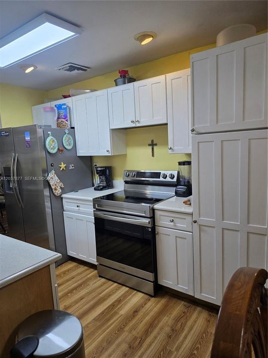The kitchen comes equipped with stainless steel appliances.