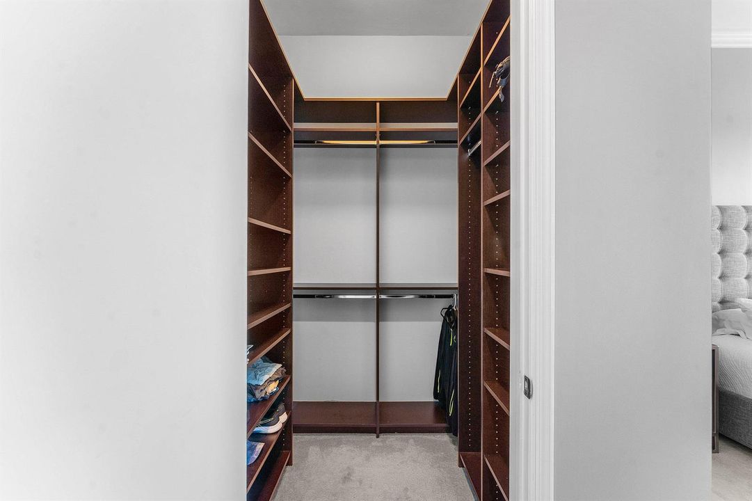 1 of 2 Walk-In Closets in Primary