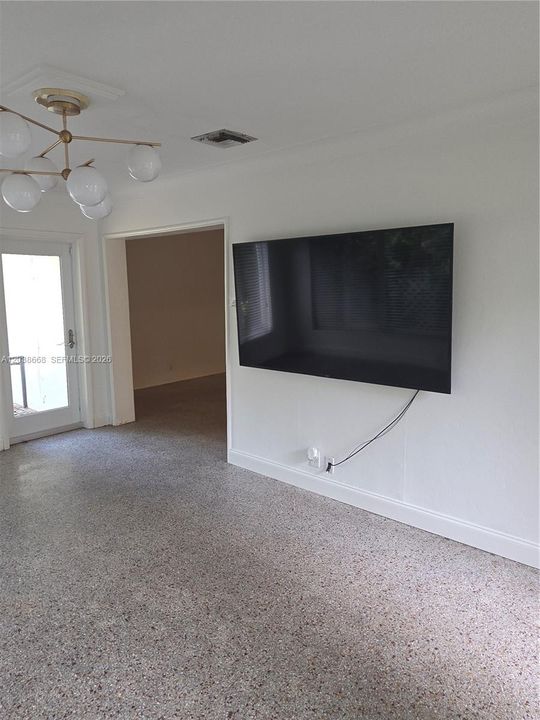 LEADS INTO DINING AREA AND KITCHEN