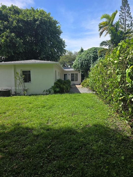 PHOTO TAKEN FROM BACK YARD TOWARDS HOUSE