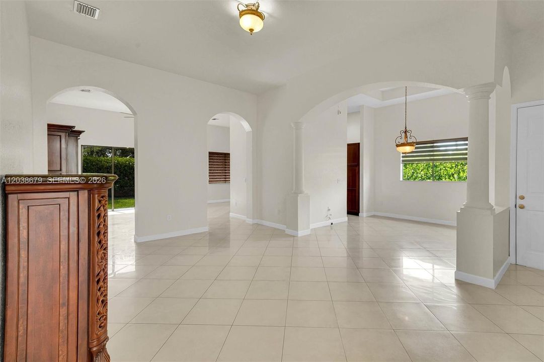 Living room with dining room in the background