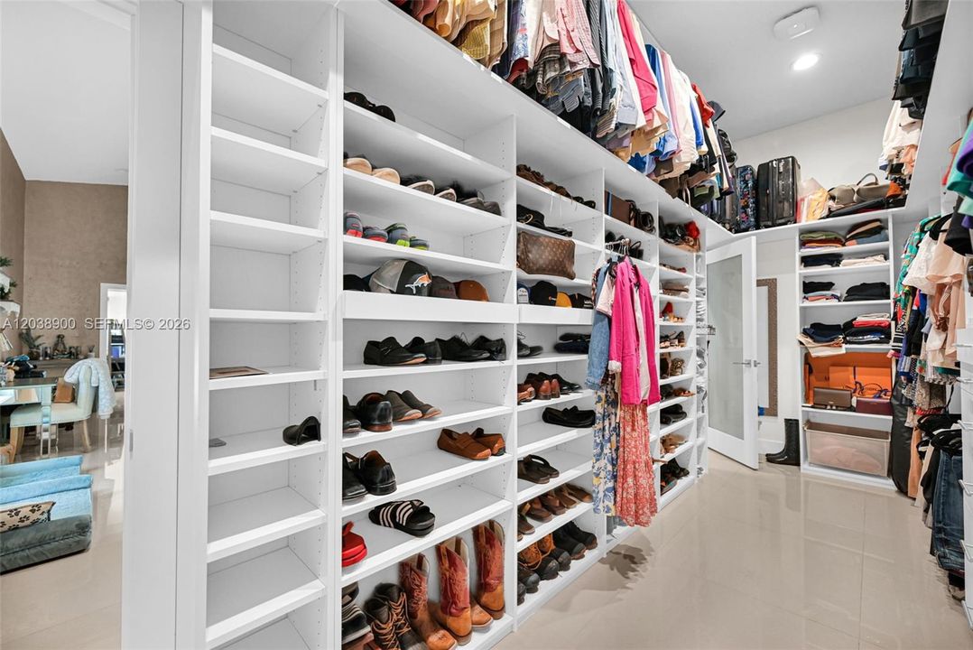 Primary bedroom walk-in closet