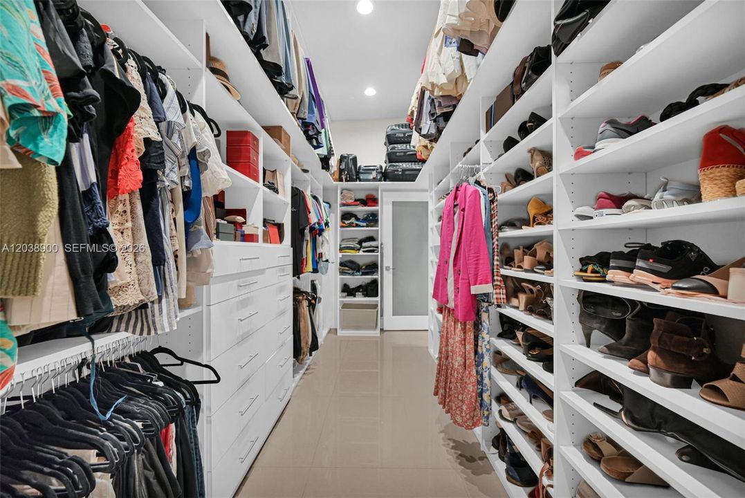 Primary bedroom walk-in closet