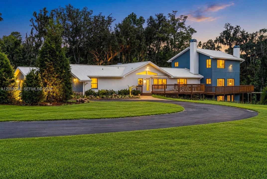 Peaceful country setting featuring a single-family residence on over 24 acres of private, usable land with mature surroundings and endless potential.