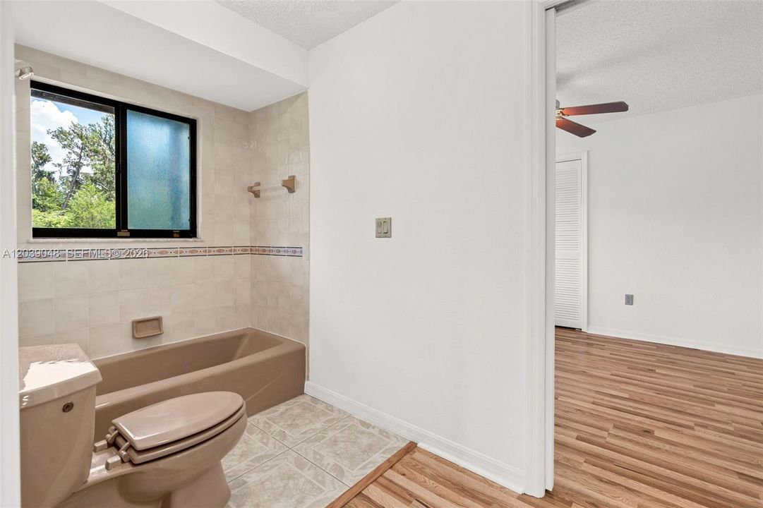 Comfortable guest bedroom offering a peaceful retreat with a functional layout and natural light.