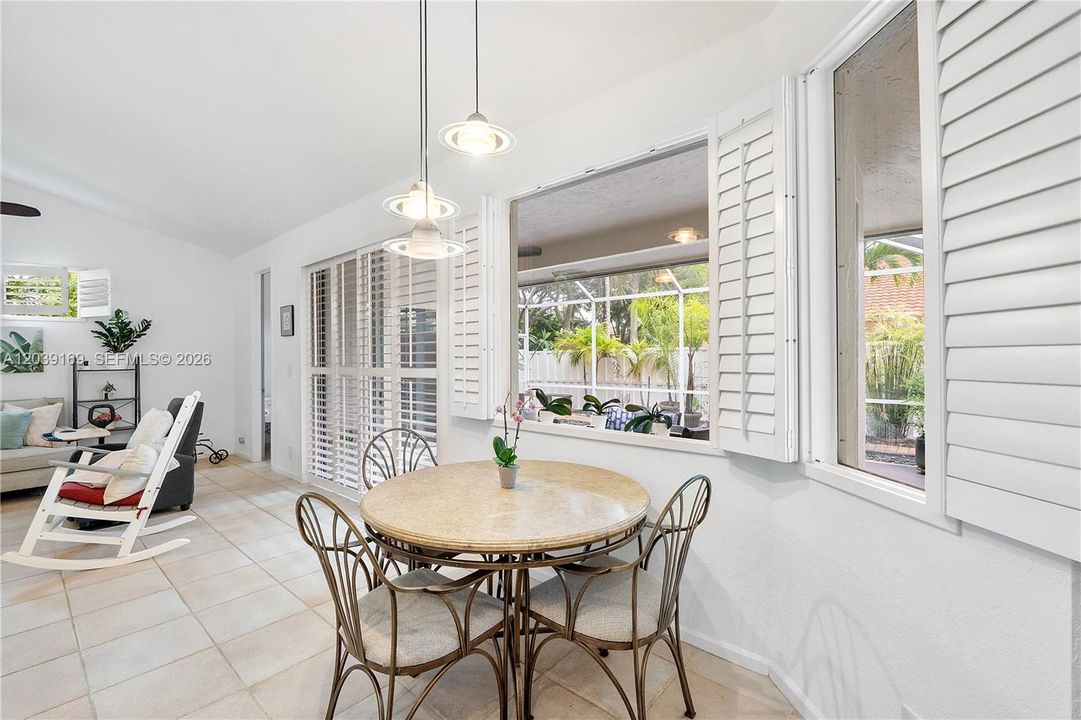 Breakfast area overlooking patio & lovely, fully fenced backyard