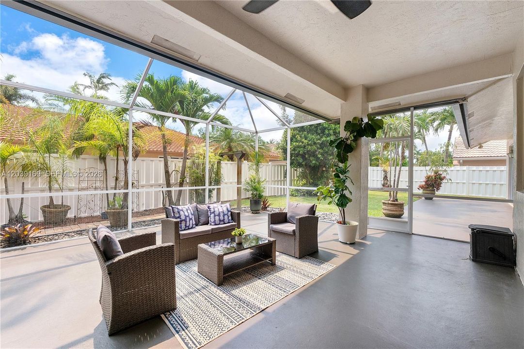 Beautiful, large, partially covered, screened in patio, fully fenced yard