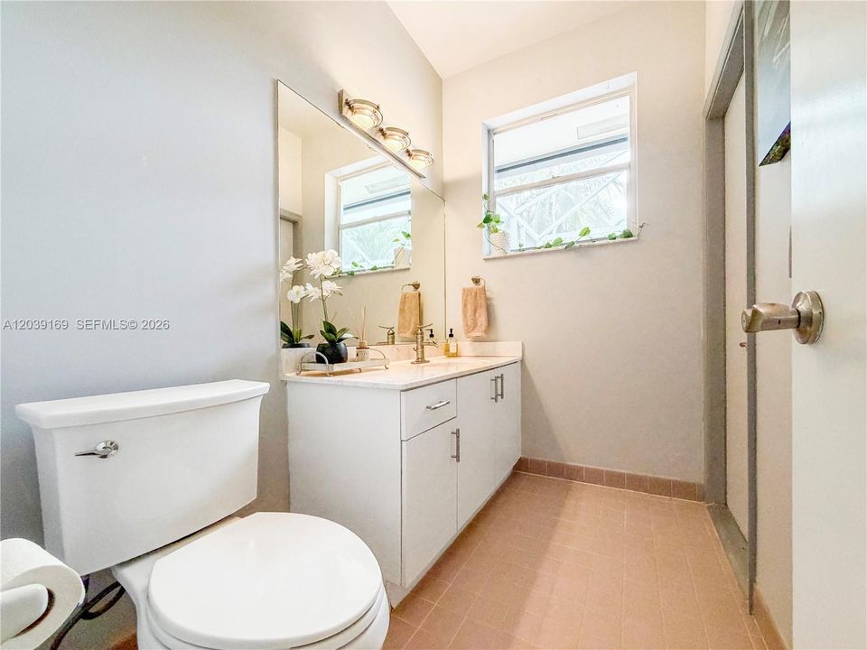 1/2 bath with access to patio