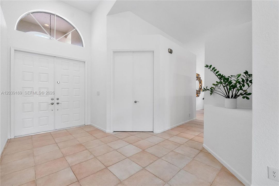 Foyer entry area with double doors to office/4th bedroom