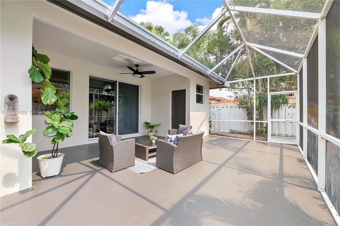 Large, partially covered, screened in patio, fully fenced yard