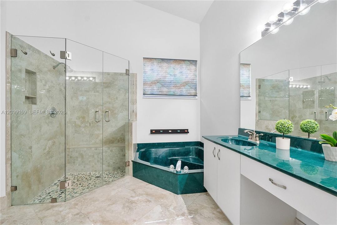 Primary bathroom with large, updated walk in shower