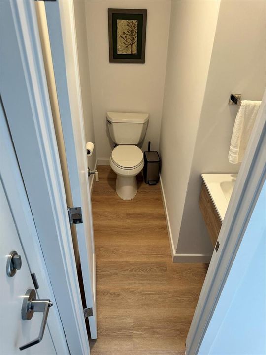 Powder room by entrance to house ...