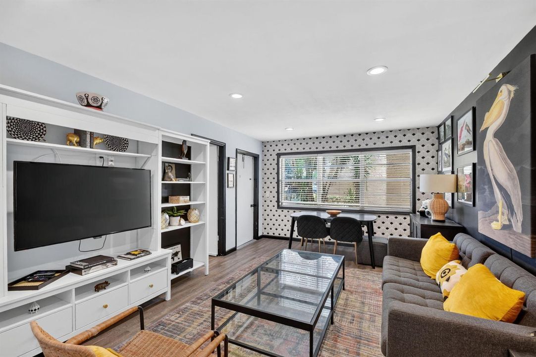 Living 2 w/ wall unit and big screen TV