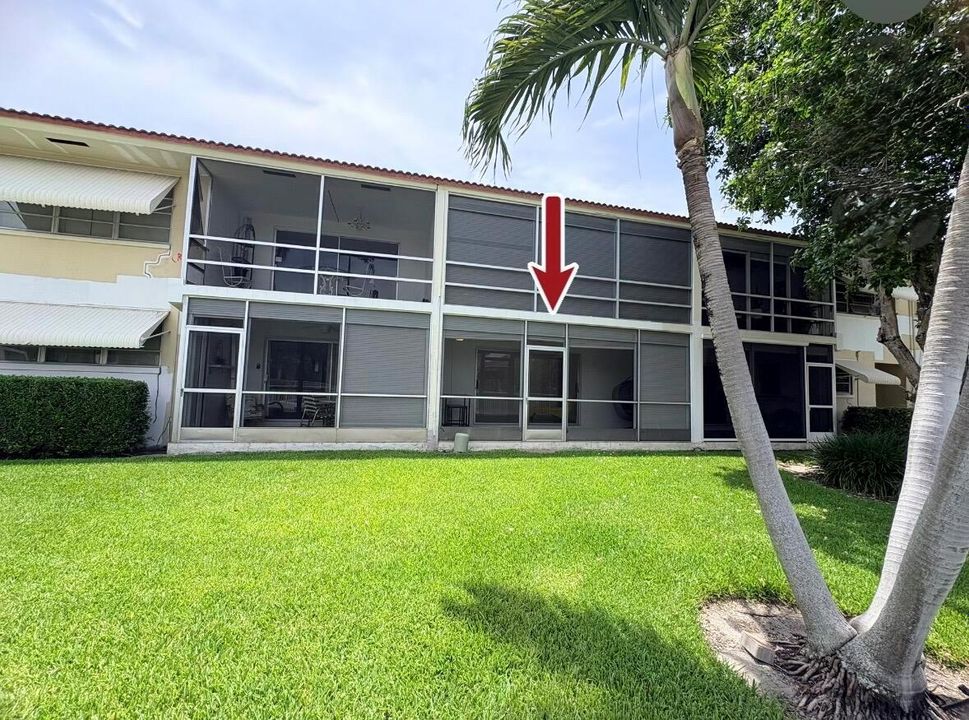 Backyard view of Condo with Arrow