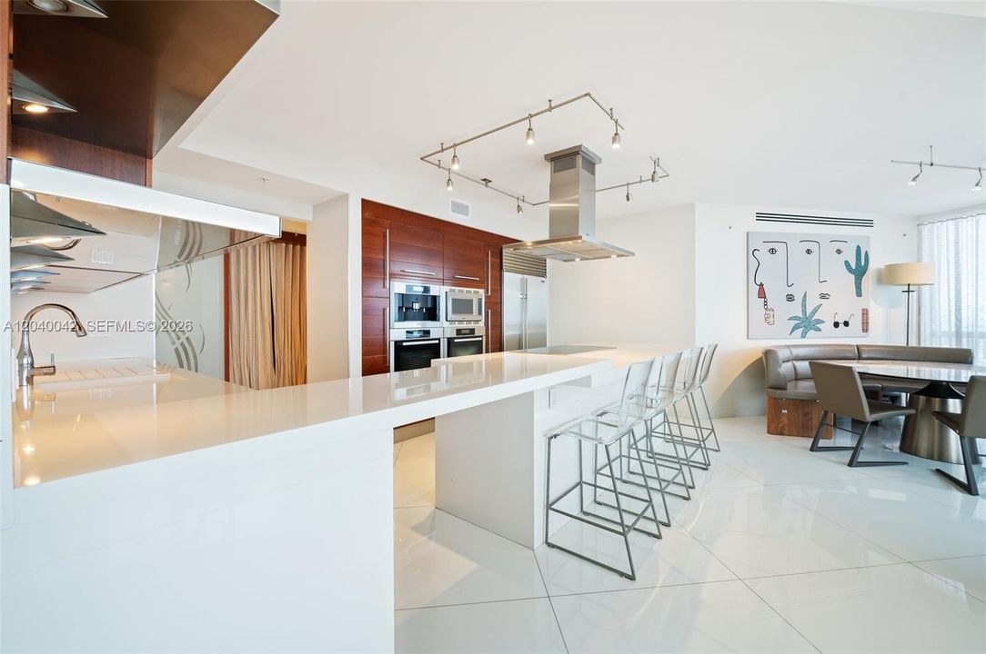 Expansive island with bar seating, perfect for casual dining and entertaining.