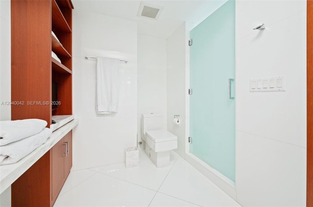 Dedicated vanity area and abundant storage.