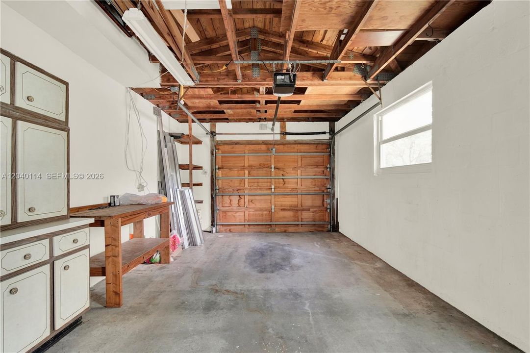Spacious garage with hurricane braced wood door * 12.6' x 24'