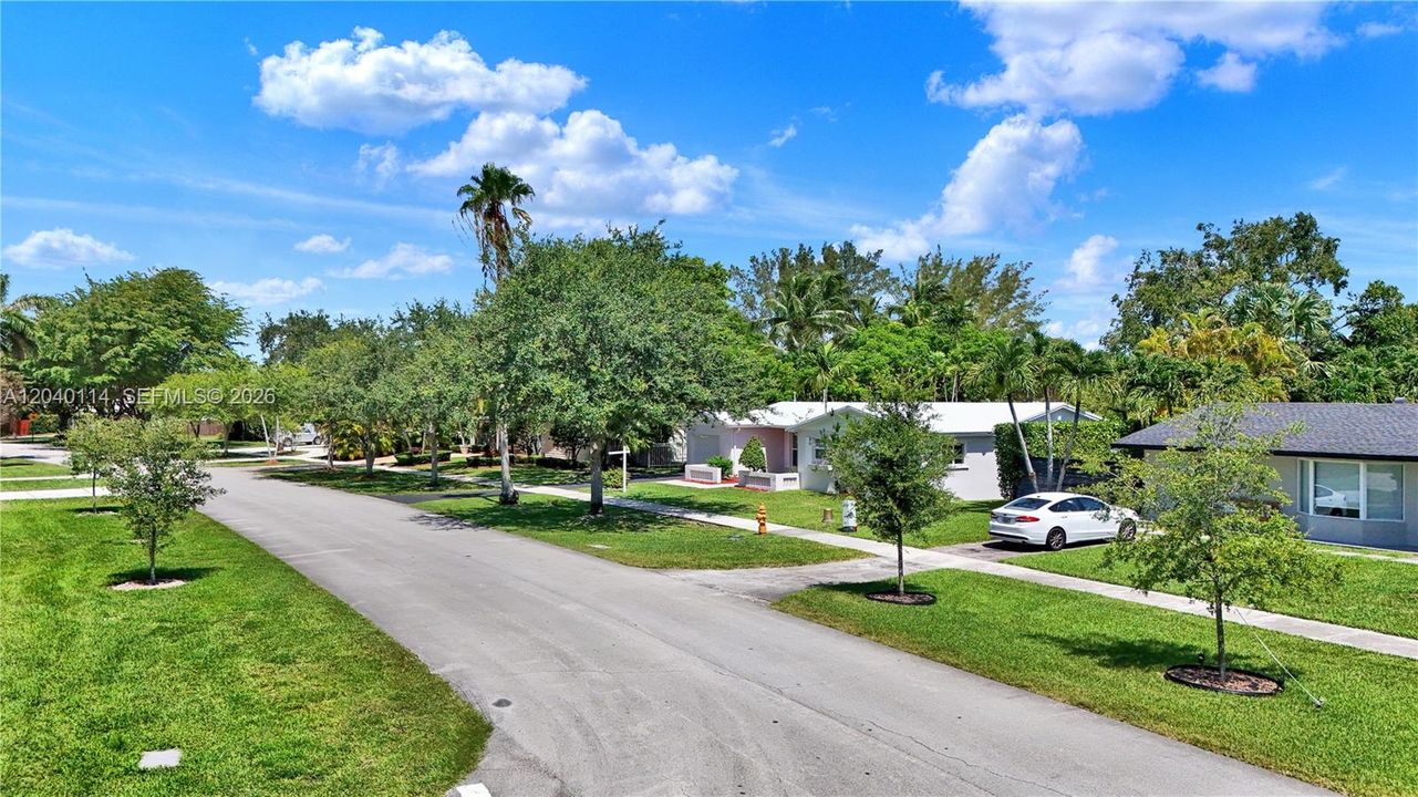 House sits back off the street with a sidewalk in the front
