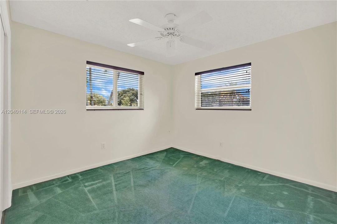 Front east corner bedroom * terrazo flooring under the carpeting * 11' x 11'
