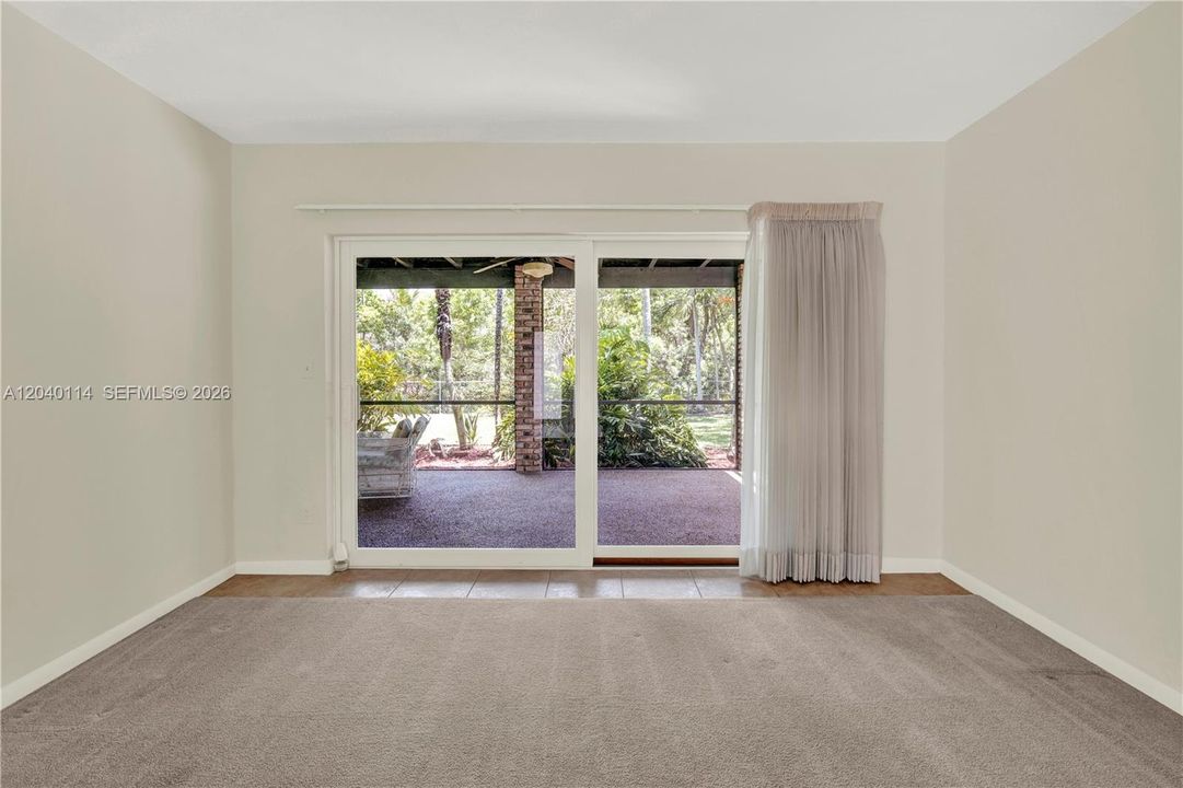Pleasant  backyard  & patio view from the living room and foyer entrance