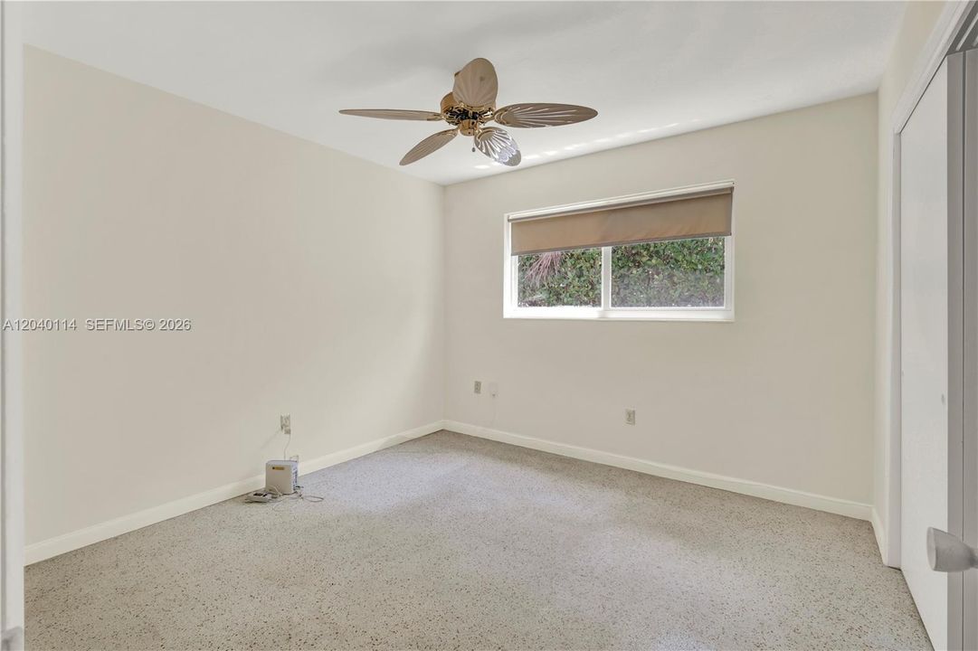 Bedroom with terrazo flooring 11' x 11'