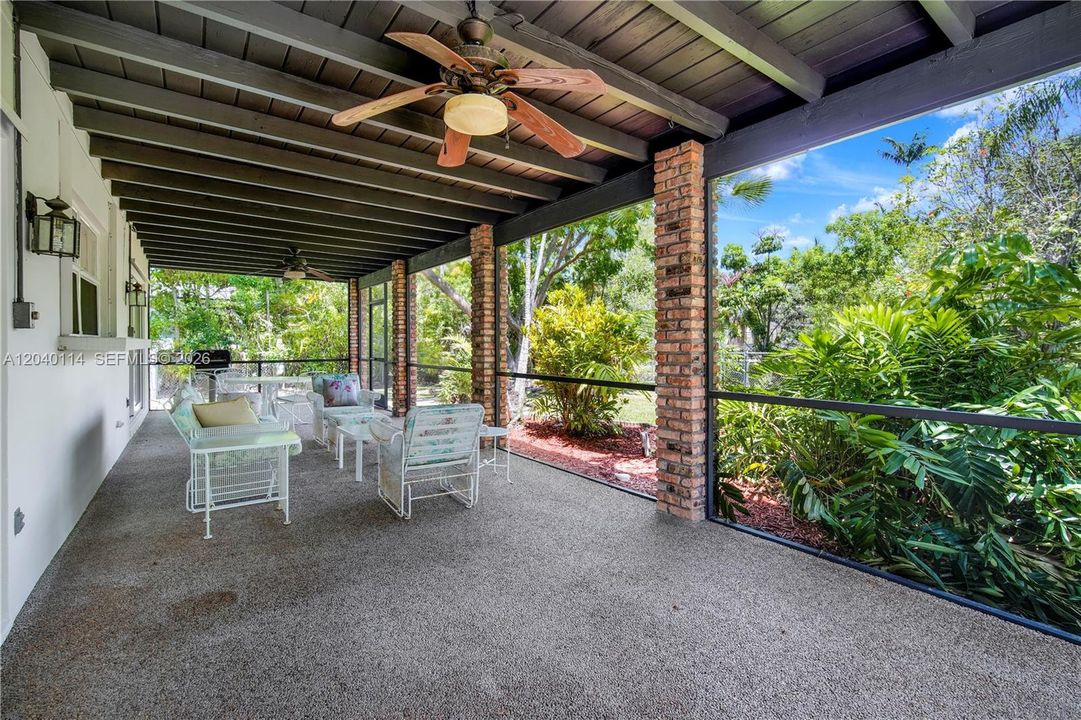 39' x 12' covered and screened-in patio ready for your afternoon BBQ's