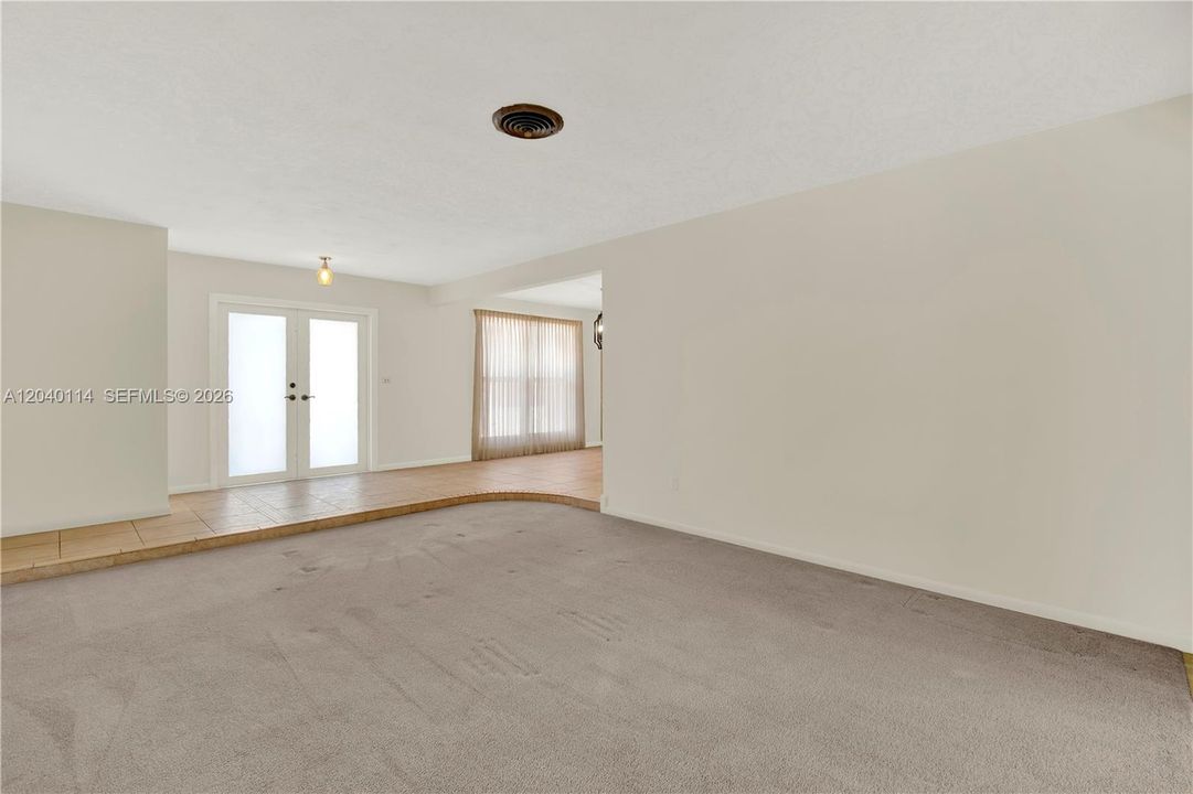 View from the living room to the foyer with lots of natural lighting