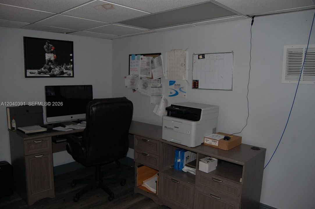 private office upstairs with TV, cameras and sofa