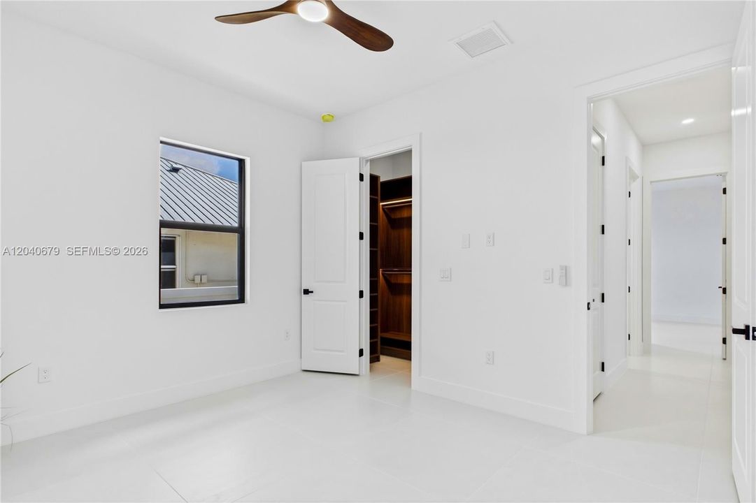 Bright and inviting guest bedroom offers comfort, privacy, and flexibility, making it ideal for family or visitors