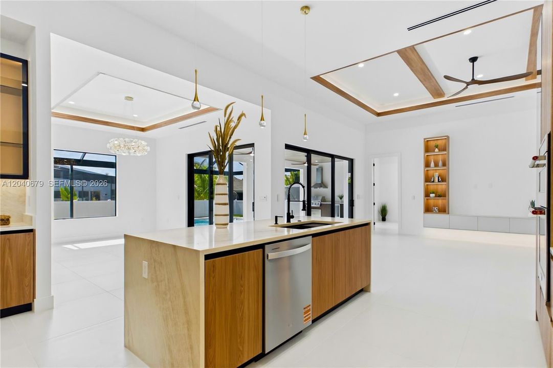 Open to the great room and dining area, this stunning space blends modern elegance with everyday convenience