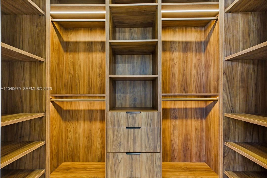 The luxurious owner's suite features dual walk-in closets