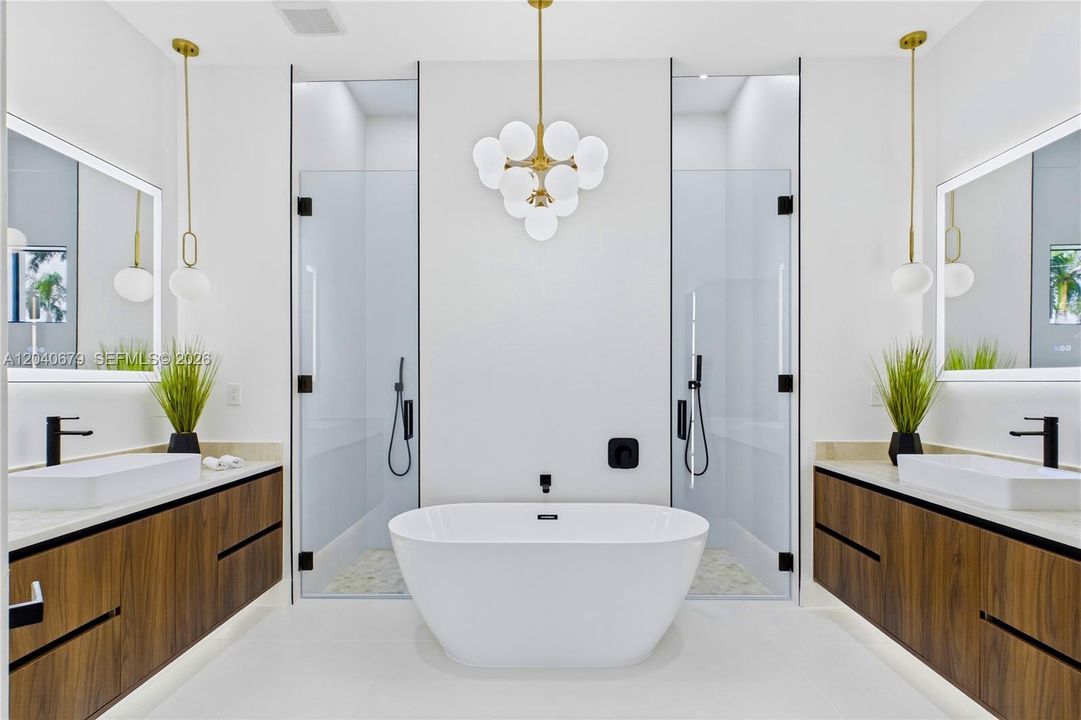 Spa-inspired bathroom w/ tiled rainfall shower, handheld showerhead, freestanding soaking tub