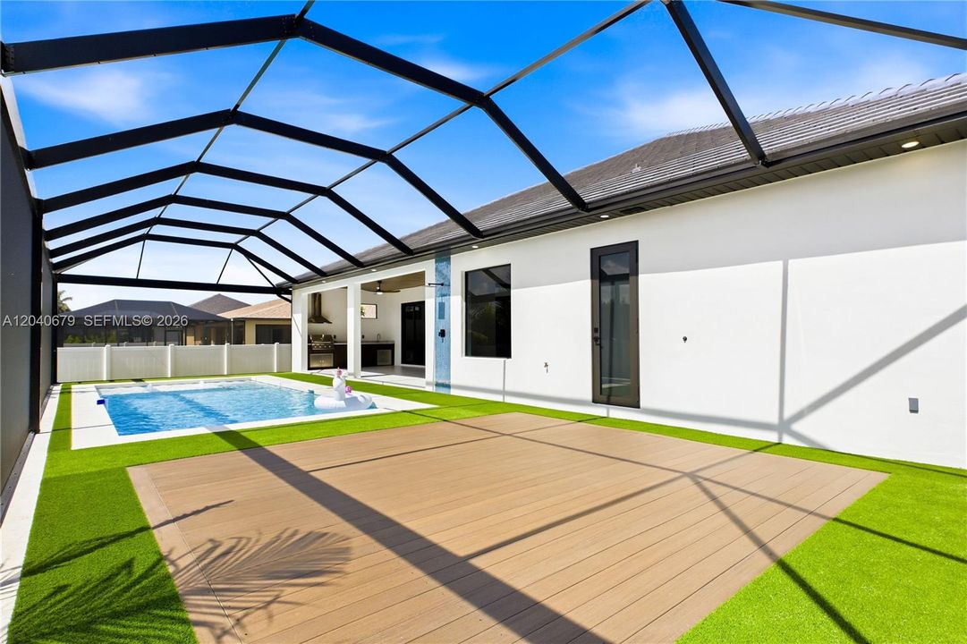 Expansive pool deck offers plenty of space for lounging, entertaining, and soaking up the SWFL sunshine