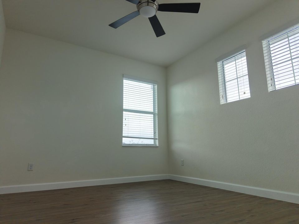 corner bedroom wood floors