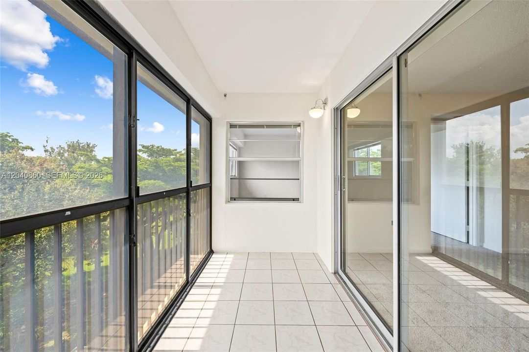 Screened in balcony with garden view