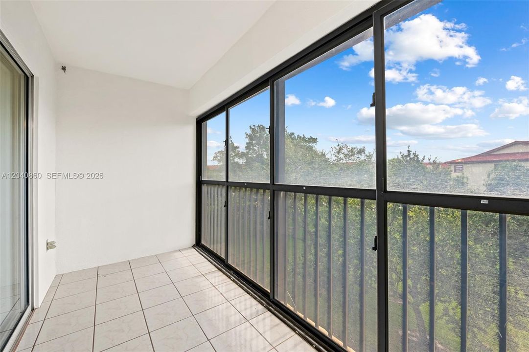 Screened in balcony with garden view