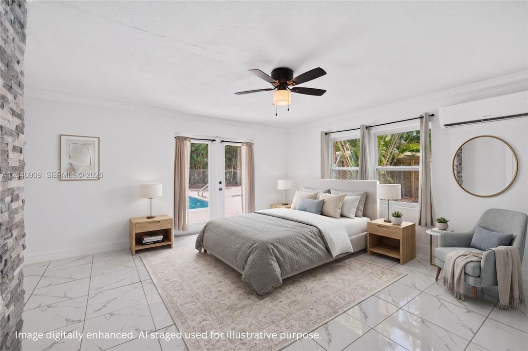 Primary bedroom with french doors to the pool area. Room also has the washer / dryer, closet and full bathroom. Image digitally enhanced. AI used for staging purposes