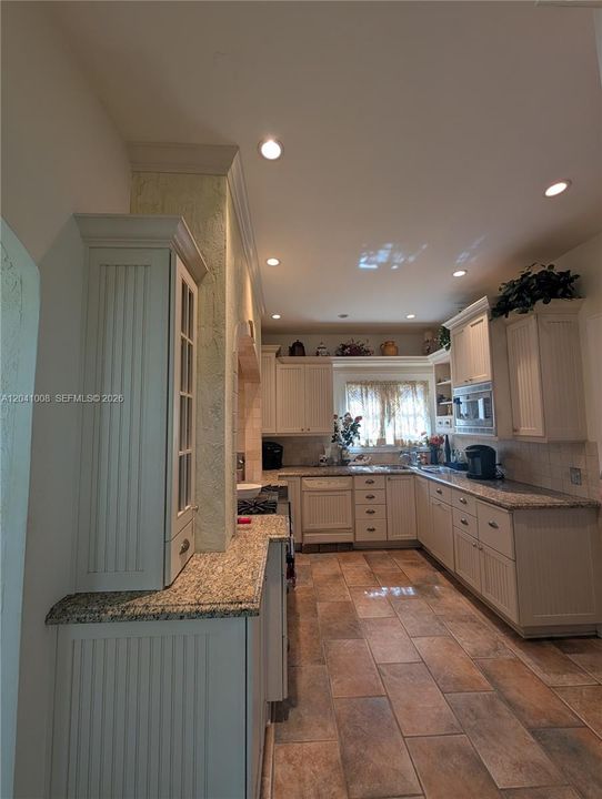 Another view of the Kitchen looking due West. Notice the kitchen window is beyond the kitchen sink and will be nice and bright in the afternoons.
