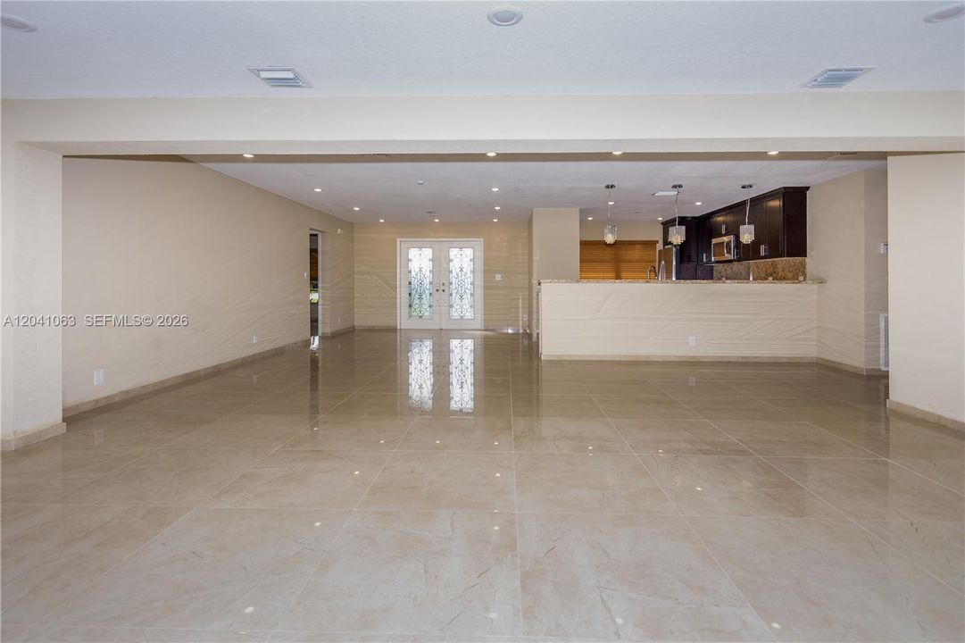 View from patio doors towards kitchen & foyer