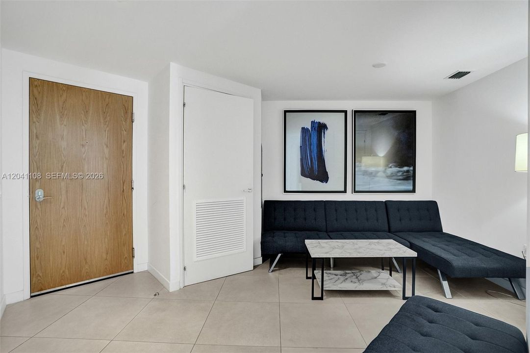 With sofa bed.  Washer and dryer in the closet pictured