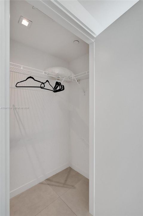 Walk-in closet in second bedroom