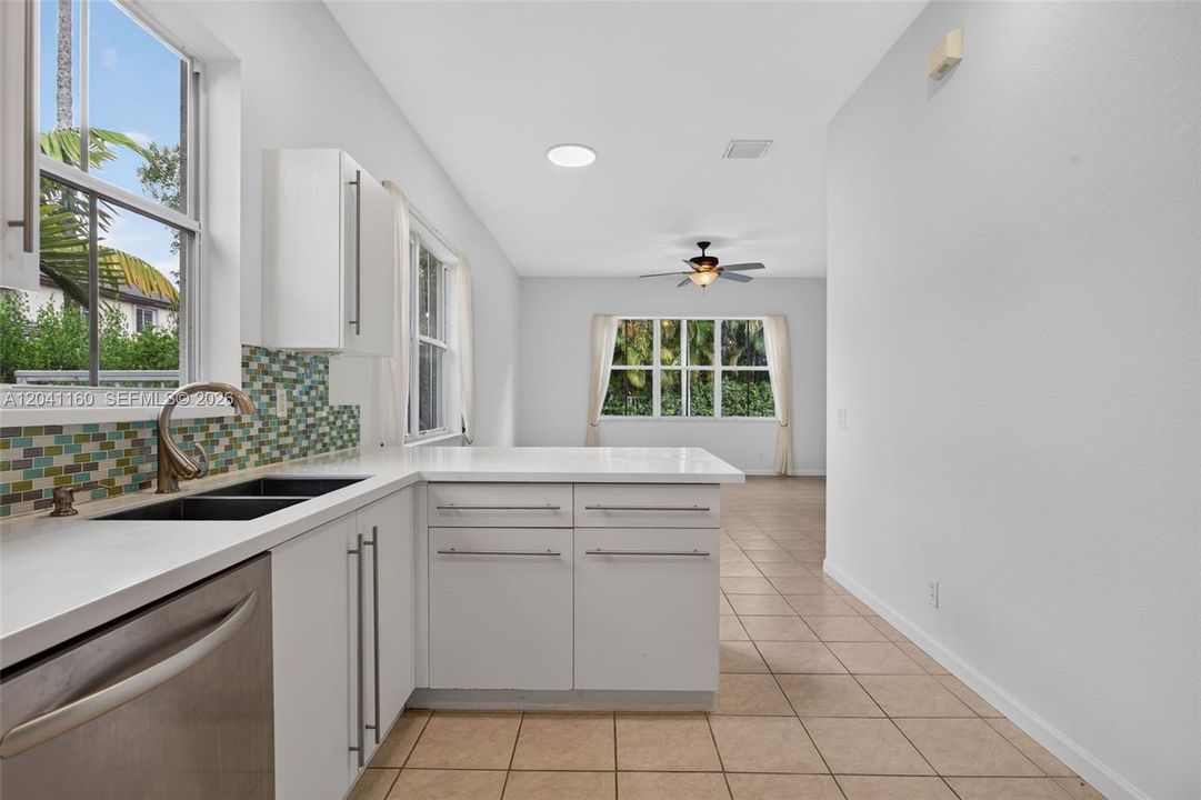 Family room with sliding doors to the patio and pool area.