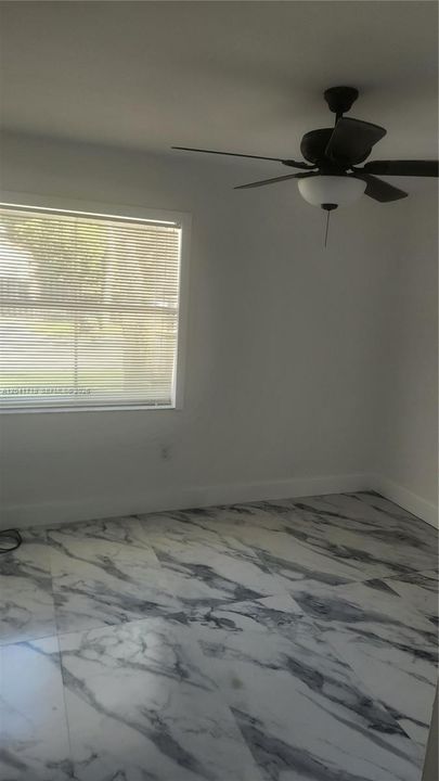 2nd bedroom with view of front of property