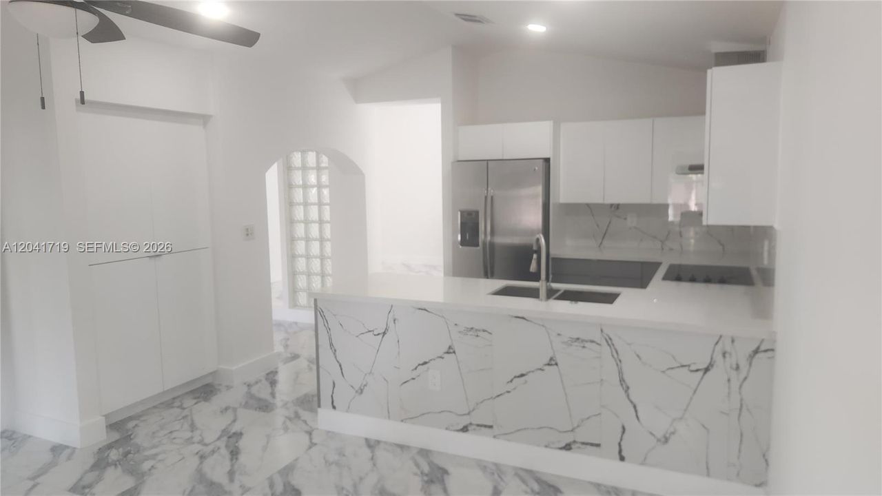 Kitchen with ample cabinets new lights and fixtures